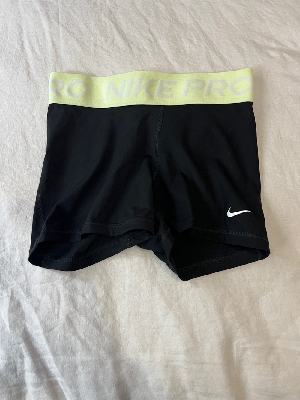 Nike Black Women's Athletic Shorts with Pale Yellow Waistband